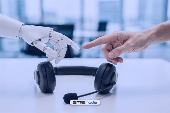 A white robotic hand and a human hand reaching toward the same help desk headset on a bright office desk