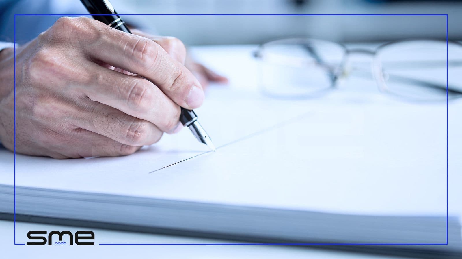 Close-up of a hand signing the last page of a bound document with a fountain pen, reading glasses nearby, the way a CPA firm signs the opinion in a SOC 2 report