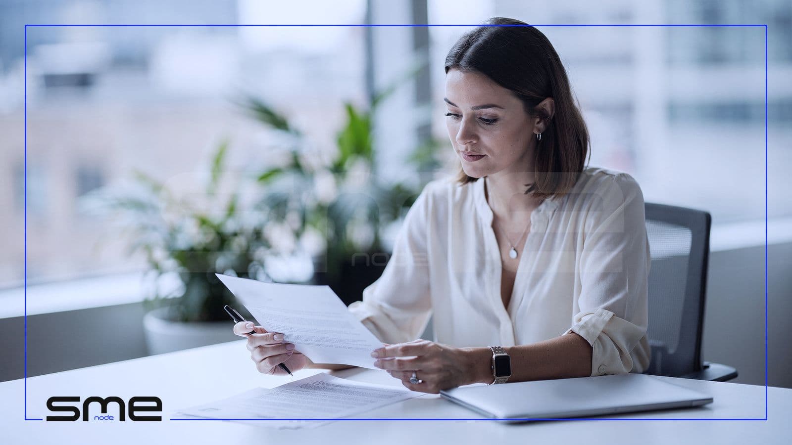 Recruiter reviewing a printed job application by hand, a human oversight step for an AI hiring tool